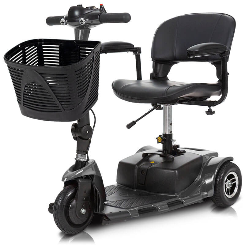 A compact mobility scooter in black, featuring a cushioned seat, handlebars, and footrests. The scooter is ideal for short distances and indoor use, shown on a smooth pathway with greenery in the background.